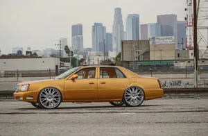 Caption: Sleek And Stunning Cadillac Deville Wallpaper