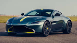 Caption: Sleek And Stylish Aston Martin Vantage In Action Wallpaper