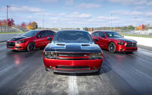 Caption: Sleek And Stylish Dodge Dart On Urban Road Wallpaper