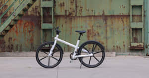 Caption: Sleek And Stylish Electric Bike Wallpaper