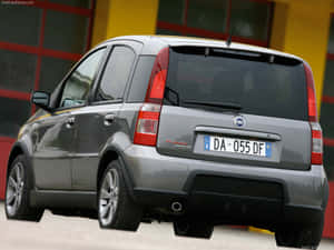 Caption: Sleek And Stylish Fiat Panda In Stunning Urban Environment Wallpaper