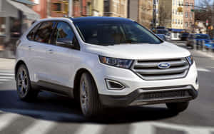 Caption: Sleek And Stylish Ford Edge On The Road Wallpaper