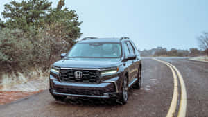 Caption: Sleek And Stylish Honda Pilot On The Road Wallpaper