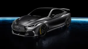 Caption: Sleek And Stylish Infiniti Q60 On The Road Wallpaper