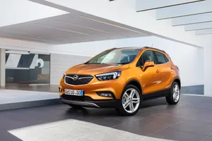 Caption: Sleek And Stylish Opel Mokka On A Scenic Road Wallpaper