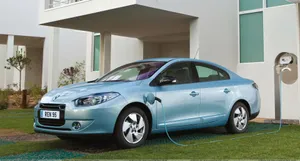 Caption: Sleek And Stylish Renault Fluence In Action Wallpaper