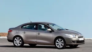 Caption: Sleek And Stylish Renault Fluence On The Road Wallpaper
