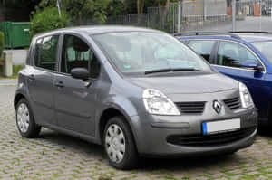 Caption: Sleek And Stylish Renault Modus In Action Wallpaper