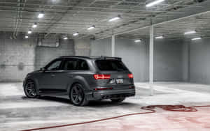 Caption: Sleek Audi Q7 On Open Road Wallpaper