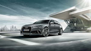 Caption: Sleek Audi Rs6 In Motion Wallpaper