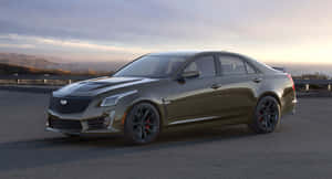 Caption: Sleek Black Cadillac Cts On The Road Wallpaper