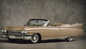 Caption: Sleek Black Cadillac Eldorado Cruising On The Open Road Wallpaper