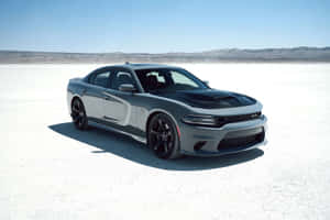 Caption: Sleek Black Dodge Charger On The Open Road Wallpaper