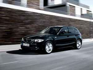 Caption: Sleek Bmw 1 Series In Action Wallpaper