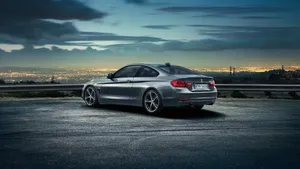 Caption: Sleek Bmw 4 Series On The Road Wallpaper