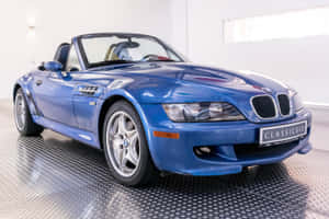 Caption: Sleek Bmw Z3 Roadster On The Road Wallpaper