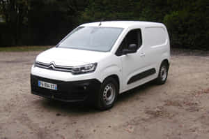 Caption: Sleek Citroen Berlingo In Scenic Road Trip Wallpaper