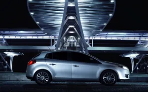 Caption: Sleek Fiat Bravo Gliding On An Urban Road Wallpaper