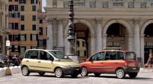 Caption: Sleek Fiat Multipla Posing Elegantly On The Streets Wallpaper