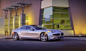 Caption: Sleek Fisker Ev On A Scenic Coastal Highway Wallpaper