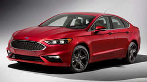 Caption: Sleek Ford Fusion Cruising On A Scenic Road Wallpaper