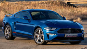 Caption: Sleek Ford Mustang California Special Cruising On The Highway Wallpaper