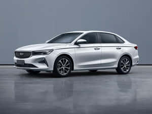 Caption: Sleek Geely Emgrand In Golden Light Wallpaper