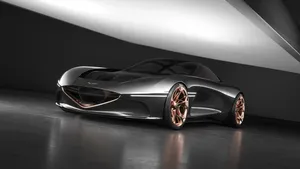 Caption: Sleek Genesis Essentia Concept Car On Display Wallpaper