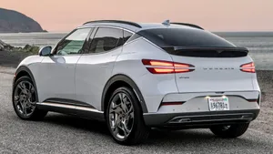 Caption: Sleek Genesis Gv60 On The Open Road Wallpaper