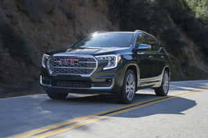 Caption: Sleek Gmc Terrain Cruising The Open Road Wallpaper