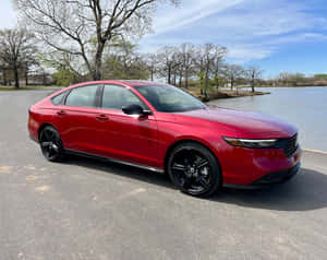 Caption: Sleek Honda Accord Parked Under The Starry Night Sky Wallpaper