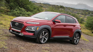 Caption: Sleek Hyundai Kona At Sunset Wallpaper