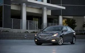 Caption: Sleek Hyundai Sonata Cruising On A Scenic Road Wallpaper