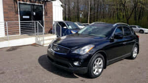 Caption: Sleek Infiniti Ex35 On A Serene Street Wallpaper