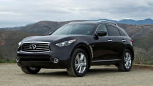 Caption: Sleek Infiniti Qx70 Car In A Majestic Outdoor Background Wallpaper