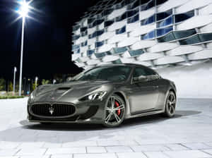 Caption: Sleek Maserati Quattroporte In Stylized Lights Wallpaper