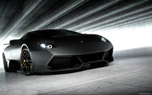 Caption: Sleek Matte Black 3d Car In High Definition Wallpaper