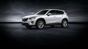 Caption: Sleek Mazda Cx-5 On The Road Wallpaper
