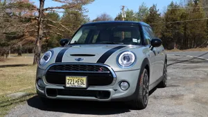 Caption: Sleek Mini Cooper Hardtop 2 Door In Dynamic Running Shot Wallpaper
