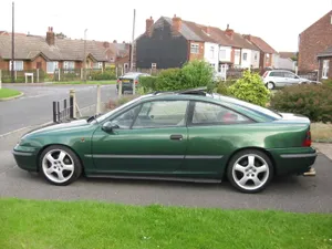 Caption: Sleek Opel Calibra- A Blend Of Performance And Elegance Wallpaper