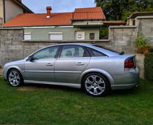 Caption: Sleek Opel Vectra In Elegant Silver Wallpaper