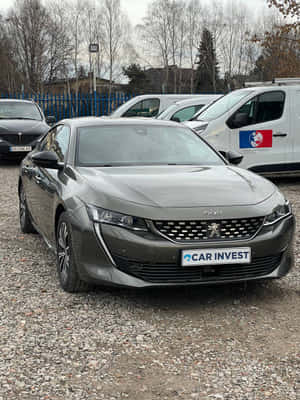 Caption: Sleek Peugeot 508 Under The Twilight Sky Wallpaper