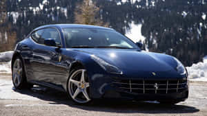 Caption: Sleek Red Ferrari Ff On The Open Road Wallpaper