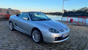 Caption: Sleek Red Mg Sports Car Wallpaper