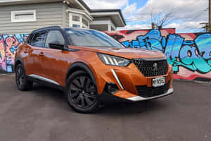 Caption: Sleek, Red Peugeot 2008 Gliding On The Highway Wallpaper
