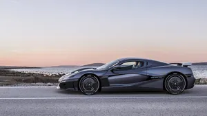 Caption: Sleek Rimac Automobili Electric Supercar On The Move Wallpaper