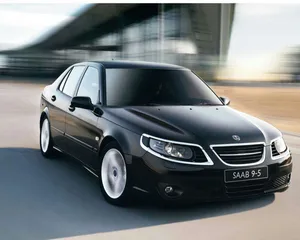 Caption: Sleek Saab 9-5 Car In An Outdoor Setting Wallpaper