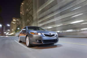 Caption: Sleek Silver Acura Tsx In Stunning Landscape Wallpaper