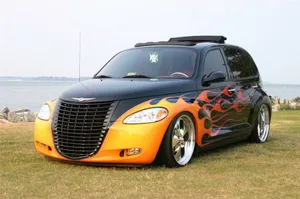 Caption: Sleek Silver Pt Cruiser On The Road Wallpaper