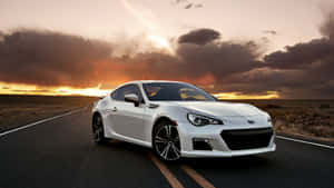 Caption: Sleek Subaru Brz In Action Wallpaper